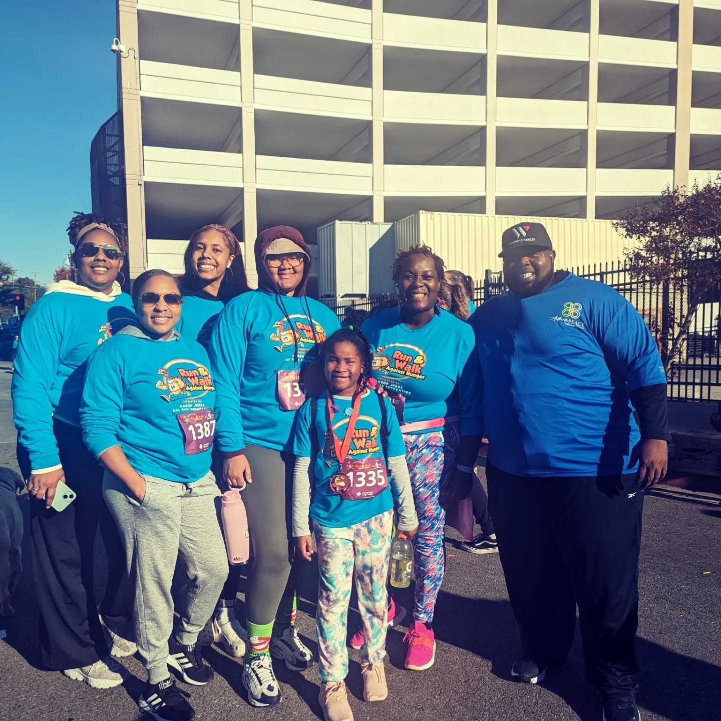 Authentic Peace Wellness Center board and community members participating in a community run and walk.